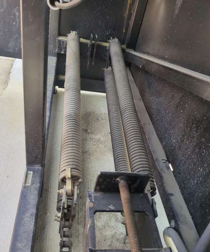Worn gate operator springs before replacement