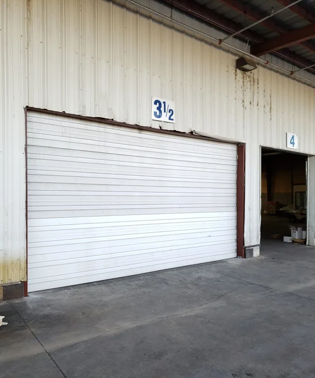 Commercial sectional overhead door on a warehouse bay